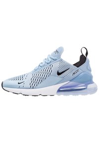 Light blue athletic sneakers with mesh upper, black accents, and a visible air unit in the heel. Features a lace-up design and textured patterns.
