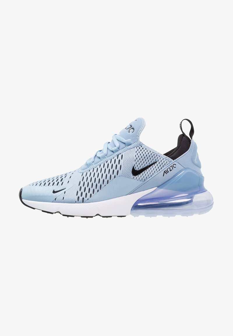Light blue athletic sneakers with mesh upper, black accents, and a visible air unit in the heel. Features a lace-up design and textured patterns.