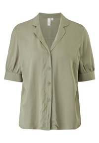Blouse vert clair à manches courtes avec col, fermeture à boutons sur le devant et texture subtile. Présente des manches bouffantes et une coupe ample.