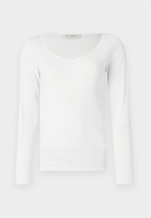 Balta ilgomis rankovėmis palaidinė su gumuluota tekstūra, turinti gilią V formos iškirptę ir prigludusią siluetą. Pagaminta iš lygaus, tamprus medžiagos.