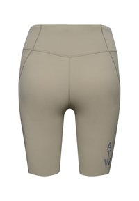Shorts de cycliste beige taille haute avec coutures flatlock et lettres « ATW » imprimées verticalement sur la partie inférieure de la jambe gauche.