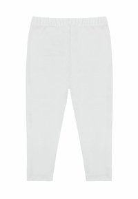Leggings bianchi in cotone con una texture morbida e una vita elastica, caratterizzati da un design lineare e una vestibilità aderente lungo le gambe.
