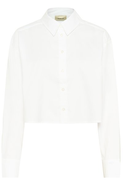 Chemise blanche raccourcie à manches longues, col pointu et boutonnage devant. Fabriquée dans un tissu lisse avec un design épuré et minimaliste.