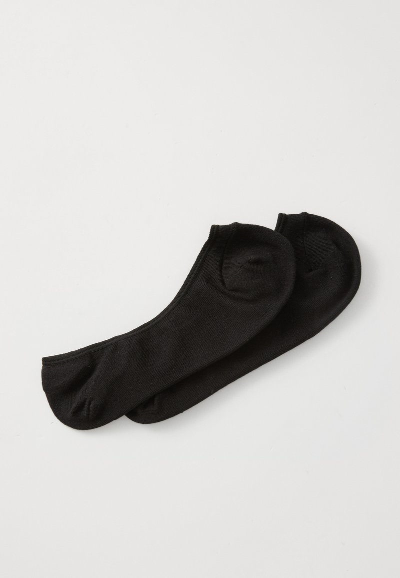 Calze alla caviglia nere realizzate in un tessuto morbido e elasticizzato con un design senza cuciture e senza motivi o loghi visibili.