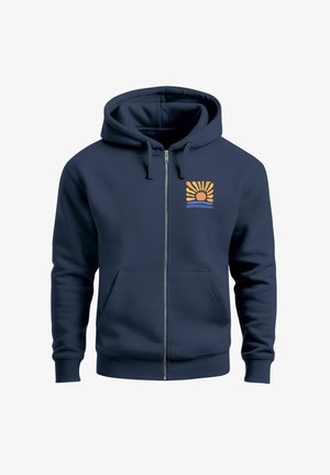 Navy zip-up hoodie made of soft fabric, featuring a sun and wave graphic in orange and blue on the left chest area. Front pockets included.