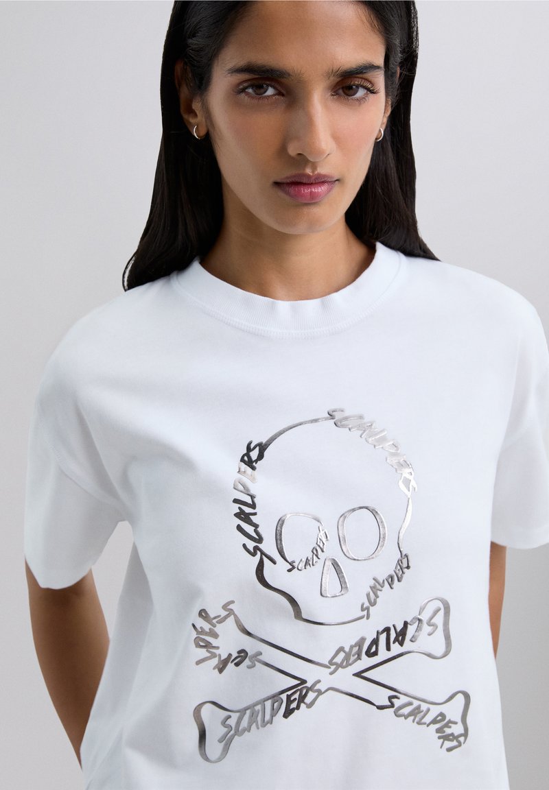 White cotton t-shirt featuring a silver graphic of a skull and crossbones with the word "SCALPERS" integrated into the design.