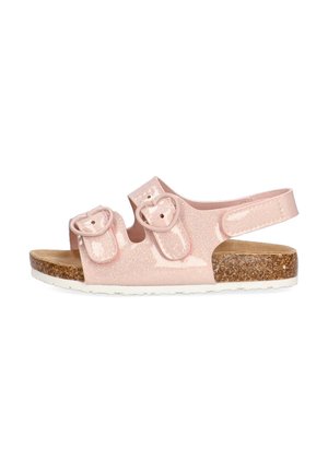Sandalias rosas con purpurina, dos correas ajustables, hebillas en forma de corazón, plantilla de corcho y suela de goma blanca. Diseño ligero y abierto.