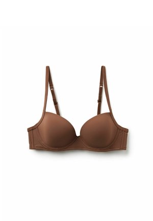 Soutien-gorge beige rembourré avec fines bretelles ajustables. Texture lisse, armatures pour un maintien optimal, et coutures simples le long des bords.