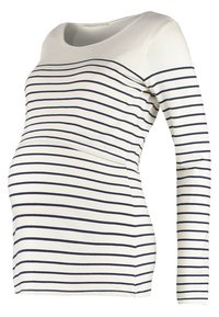 Haut de maternité blanc à manches longues avec rayures horizontales bleu marine et encolure ronde, conçu pour accueillir un ventre de femme enceinte.