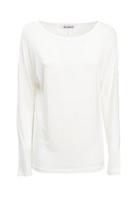 Camicia bianca a maniche lunghe in morbido tessuto con scollatura ampia e vestibilità rilassata. Design semplice senza motivi o dettagli.