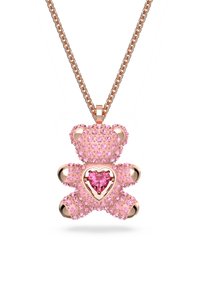 Pink teddy bear pendant encrusted with sparkling crystals, featuring a heart-shaped gem at the center, hangs from a rose gold chain.
