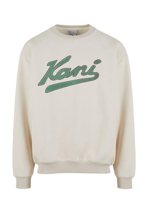 Krämfärgad sweatshirt med ribbade mudd och fåll. Har en strukturerad grön "Kani"-logotyp i kursiv stil över framsidan. Mjuk tyg, avslappnad passform.