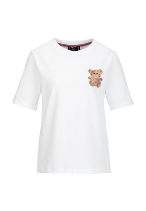 Witte katoenen T-shirt met korte mouwen, voorzien van een teddybeerafbeelding in beige met rode accenten op de borst. Ronde halslijn, ontspannen pasvorm.