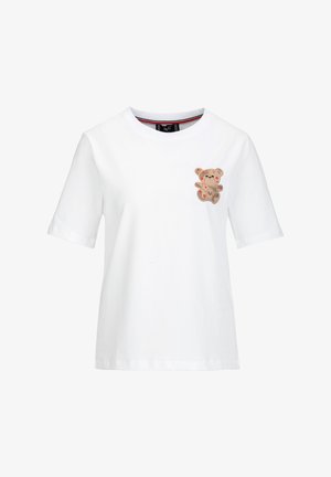White cotton T-shirt with short sleeves featuring a teddy bear graphic in beige and red accents on the chest. Round neckline, relaxed fit.
