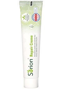 Sörion Repair Creme in a white tube features green and white geometric patterns, a flip-top cap, and labels indicating its uses and benefits.