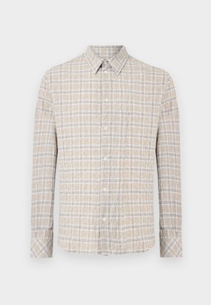 Beige langermet skjorte med knapper, hvitt og grått rutemønster og brystlomme.