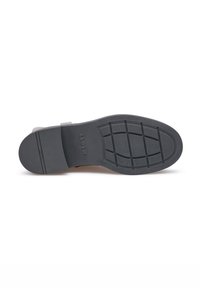 Zool van een schoen in zwart rubber, voorzien van een gestructureerd grippatroon en looplijnen. Geëmbosseerd merk is zichtbaar nabij de hak.