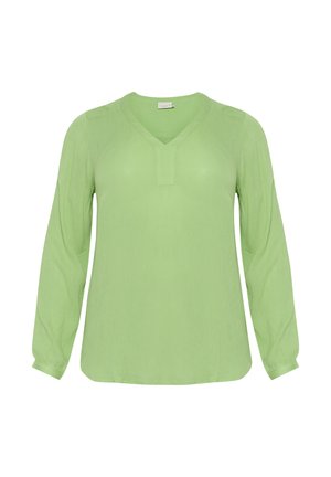 Bluzka z długim rękawem w jasnym zielonym kolorze, z dekoltem w kształcie V, subtelną teksturą oraz luźnym fasonem z zaokrąglonym dołem i marszczonymi mankietami.