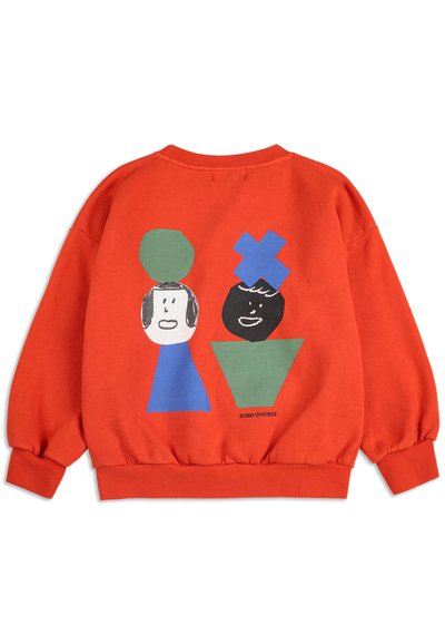 Oranje sweatshirt met ribbelmanchetten en -zoom, voorzien van speelse grafische vormen en gezichten in blauw, groen, zwart en wit op de achterkant.