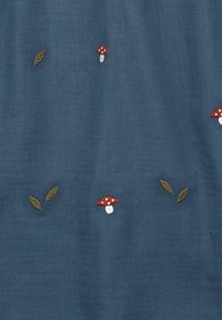 Blue fabric with embroidered red mushrooms and green leaves, featuring a soft texture and a subtle, even pattern throughout.