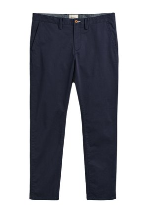 Navy chinos featuring a button closure, side pockets, and a smooth texture, made from lightweight cotton. Tailored fit with clean lines.