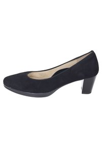 Pump nera in suede con punta arrotondata e tacco a blocco leggermente rialzato. Fodera interna liscia e design minimalista.