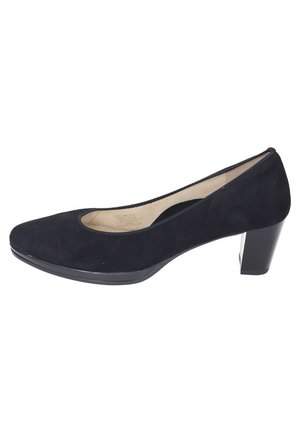 Black suede pump with rounded toe and a slightly elevated block heel. Smooth interior lining and minimalistic design.