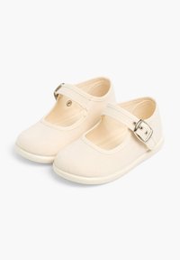 Beige plátěné boty Mary Jane se silným páskem a detailem s přezkou. Kulatá špička a flexibilní gumová podrážka pro pohodlí a snadnost nošení.