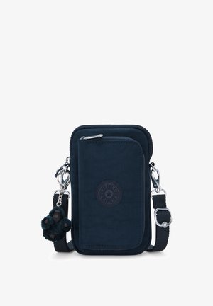 Lille mørkeblå tværgående taske med frontlomme med lynlås, justerbar rem og fastgjort plysdyrsaber nøglering.