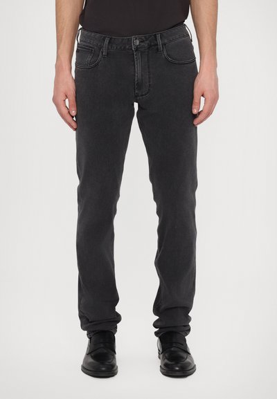 Blugi negri slim fit cu un finisaj decolorat, cinci buzunare și cusături contrastante. Realizați din denim cu o textură moale și un design modern.