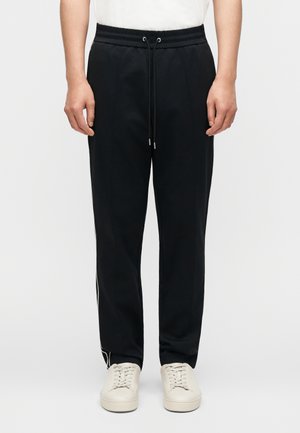 PIPING PANT - Jogginghose - black
