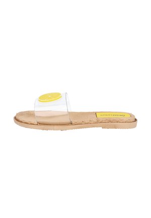 Sandalia plana con suela beige, tira transparente y detalle de una rodaja de limón en la parte superior de la tira.