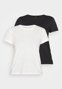 Two short-sleeve t-shirts in black and white. Both feature a crew neck, soft fabric, and a small, subtle logo in the upper left corner.