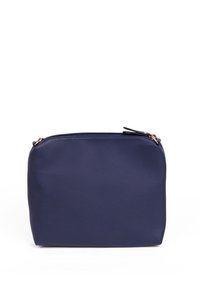 Navy blue zippered pouch made of smooth fabric; rounded edges; features a small black zipper pull with rose gold hardware accents.