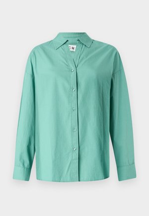 Lys grøn button-up skjorte lavet af bomuld, med krave, lange ærmer og lige kant med en afslappet pasform.