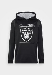 Černá mikina s kapucí a šedým vnitřkem, dlouhé rukávy. Na přední straně je bílá raiders logo a text: "LAS VEGAS RAIDERS".