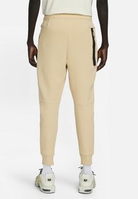 Nike Sportswear Träningsbyxor - beige