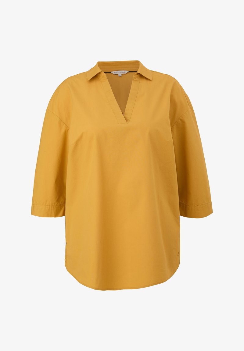 Blouse ample jaune moutarde avec manches trois-quarts, col et ouverture en V, présentée sur fond blanc.