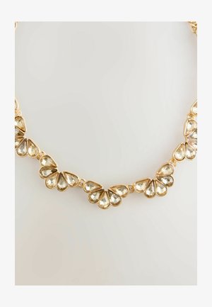 Goldfarbener Halsreifen mit tropfenförmigen klaren Kristallen, die in einem blattartigen Muster angeordnet sind, ergänzt durch glänzende metallische Akzente und Glieder.