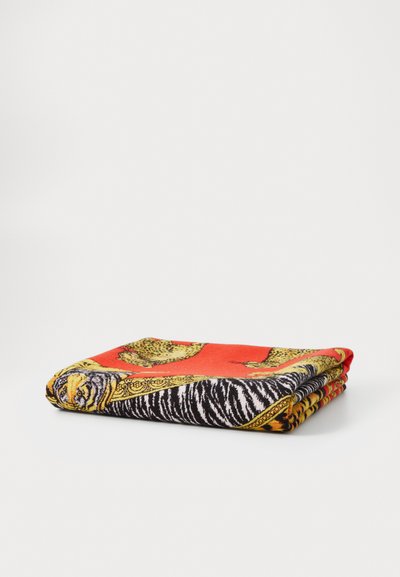 Multicolored scarf featuring a vivid red background, black and white zebra stripes, and gold-accented animal patterns. Soft, textured fabric.