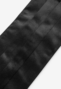 Black satin ribbon featuring three parallel pleats, smooth texture, and a soft sheen, measuring approximately 2 inches in width.