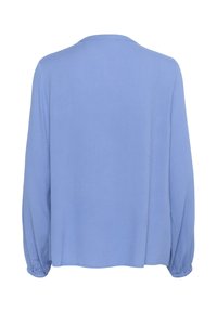 Haut à manches longues bleu clair avec un tissu texturé, coupe décontractée et poignets froncés. L'arrière est uni avec un col rond.