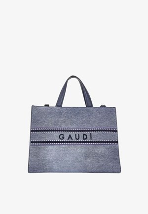 Borsa tote rettangolare in denim blu con doppi manici, due bande orizzontali a righe e la scritta "GAUDI" al centro.