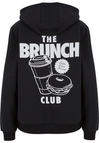 Black hoodie featuring white graphic design: a coffee cup and donut, with "THE BRUNCH CLUB" text and a starburst saying "Enjoy Every Moment."