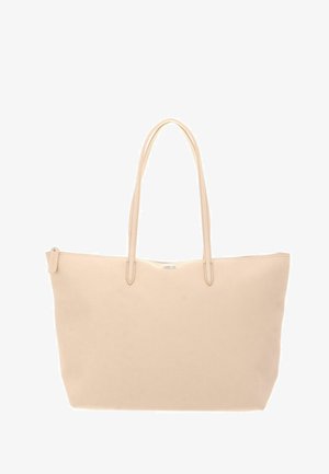 Beige leather tote bag with two long handles and a zipper closure along the top edge.