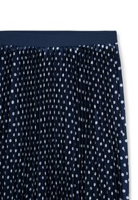 Gonna plissettata blu navy con pois bianchi, dotata di una vita elastica e una texture setosa, progettata con pois uniformi su tutta la stoffa.