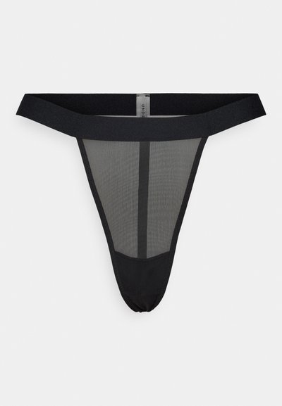 Svart mesh thong undertøy med bred elastisk midjebånd, med en vertikal søm i midten foran.