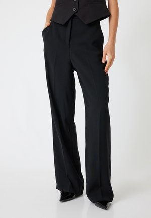 Black wide-leg trousers made from smooth fabric, featuring a high waist, side pockets, and a tailored fit.