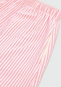 Lekkie spodnie piżamowe z miękkiej bawełny, w naprzemienne różowe i białe paski, z elastycznym pasem oraz kieszeniami bocznymi.