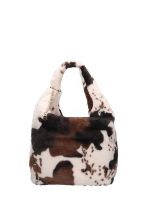 Sac à main en fausse fourrure douce avec un motif tacheté de vache marron, noir et blanc et un détail de chaîne dorée sur la poignée.